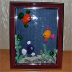 Картина из ракушек «Цветные рыбки»